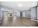 An expansive living room boasts a brick fireplace, hardwood floors, and an open layout for entertaining at 2511 Due West Nw Cir, Kennesaw, GA 30152