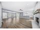 Spacious living room features a brick fireplace, hardwood floors, and lots of natural light at 2511 Due West Nw Cir, Kennesaw, GA 30152