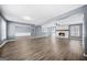 Spacious living room features a fireplace, hardwood floors, and neutral paint, offering warmth and modern elegance at 2511 Due West Nw Cir, Kennesaw, GA 30152