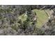 Aerial view of the property showcasing the house, surrounding trees, and driveway at 689 Hardin Rd, Temple, GA 30179
