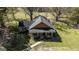 Overhead shot of a beautiful home showing landscaping, walkway, and cozy front porch at 689 Hardin Rd, Temple, GA 30179
