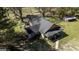 Aerial view of the property showcasing the home, surrounding trees, and expansive grounds at 689 Hardin Rd, Temple, GA 30179