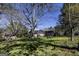 Expansive backyard featuring mature trees, a picnic table, and a shed at 689 Hardin Rd, Temple, GA 30179
