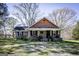 Charming brick home with a welcoming front porch and well-maintained landscaping at 689 Hardin Rd, Temple, GA 30179