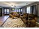 Relaxing living room with a ceiling fan, hardwood floor, and two reclining sofas facing a unique coffee table at 689 Hardin Rd, Temple, GA 30179