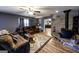 Living room with brick wood burning stove and two reclining sofas facing a rustic coffee table at 689 Hardin Rd, Temple, GA 30179