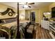 Primary bedroom with four poster bed, ensuite bath, and walk in closet at 689 Hardin Rd, Temple, GA 30179