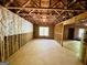 Large unfinished basement area with windows, framed walls, and visible ceiling beams at 2481 Weatherstone Cir, Conyers, GA 30094