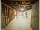 Spacious unfinished basement, ready for customization with insulated walls and concrete floor at 2481 Weatherstone Cir, Conyers, GA 30094