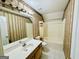 Bathroom with tub shower, vanity, and medicine cabinet offers functionality and ample space at 2481 Weatherstone Cir, Conyers, GA 30094