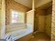Bathroom featuring a large soaking tub with jets, separate shower, and ample natural light at 2481 Weatherstone Cir, Conyers, GA 30094