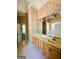 Bathroom with dual sinks, vanity, large mirror, and a separate shower and bathtub at 2481 Weatherstone Cir, Conyers, GA 30094