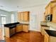 Well-maintained kitchen with granite countertops and wood cabinets at 2481 Weatherstone Cir, Conyers, GA 30094