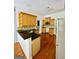 Bright kitchen featuring wood cabinets, granite countertops, and stainless steel appliances at 2481 Weatherstone Cir, Conyers, GA 30094