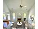 An overhead view of the living room featuring abundant natural light and a cozy fireplace at 2481 Weatherstone Cir, Conyers, GA 30094