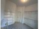 Large walk-in closet with extensive wire shelving, offering plenty of storage space at 2481 Weatherstone Cir, Conyers, GA 30094