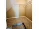 A carpeted walk-in closet provides extra storage, complete with wire shelving at 2481 Weatherstone Cir, Conyers, GA 30094