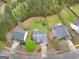Backyard features a trampoline, swing set, and mature trees at 105 Lantana Dr, Locust Grove, GA 30248