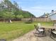 Backyard with outdoor patio set, trampoline and a swing set at 105 Lantana Dr, Locust Grove, GA 30248