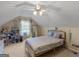 Bedroom showcasing vaulted ceiling, plush carpet, and natural light at 105 Lantana Dr, Locust Grove, GA 30248