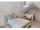 Bright bedroom offers a ceiling fan, sloped ceiling, and comfortable layout at 105 Lantana Dr, Locust Grove, GA 30248