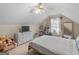Cozy bedroom features neutral tones, a ceiling fan, and a spacious layout at 105 Lantana Dr, Locust Grove, GA 30248