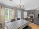 Bright dining room showcasing large windows, hardwood floors, and neutral paint at 105 Lantana Dr, Locust Grove, GA 30248