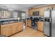 Modern kitchen features stainless steel appliances and an open layout to the dining area at 105 Lantana Dr, Locust Grove, GA 30248