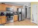 Well-equipped kitchen with stainless steel appliances and light wood cabinetry at 105 Lantana Dr, Locust Grove, GA 30248