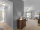 Open-concept living room boasts fireplace, ceiling fan, and seamless flow at 105 Lantana Dr, Locust Grove, GA 30248
