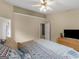 Spacious main bedroom featuring a large bed and an ensuite bathroom with neutral wall colors at 105 Lantana Dr, Locust Grove, GA 30248