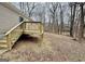 Picture of the back of house and wooden deck with railings at 54 Holly Dr, Carrollton, GA 30116