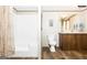 Bathroom featuring a vanity with solid surface tops, toilet, and shower at 54 Holly Dr, Carrollton, GA 30116