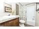 Bathroom featuring a shower, vanity, and decorative wall art at 54 Holly Dr, Carrollton, GA 30116