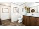 Bathroom featuring a vanity with solid surface tops, toilet, and shower at 54 Holly Dr, Carrollton, GA 30116