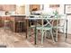 A dining table with a view of a modern kitchen with wooden cabinets and granite countertops at 54 Holly Dr, Carrollton, GA 30116