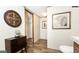 Hallway featuring a cabinet, artwork and access to the bathroom at 54 Holly Dr, Carrollton, GA 30116