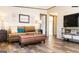 Comfortable living room with stylish furniture, hardwood floors and natural lighting at 54 Holly Dr, Carrollton, GA 30116