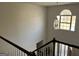 Foyer view with a window, chandelier, and stairs with wooden railings, and front door at 888 Shadow Lakes Dr, Lithonia, GA 30058