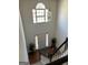Foyer view of the staircase, chandelier, front door, and decor at 888 Shadow Lakes Dr, Lithonia, GA 30058