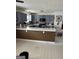 Open kitchen features gray cabinets and white countertops at 888 Shadow Lakes Dr, Lithonia, GA 30058