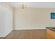 Dining area with hardwood floors, chandelier, and sliding door to patio at 7112 Brookview Way, Riverdale, GA 30274