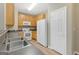 Kitchen with modern sink and white appliances with neutral color scheme at 7112 Brookview Way, Riverdale, GA 30274