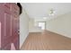 Bright, open living space features hardwood floors and neutral paint at 7112 Brookview Way, Riverdale, GA 30274