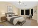 Comfortable bedroom with neutral walls, window, ceiling fan, and wood floors at 7112 Brookview Way, Riverdale, GA 30274