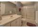 Bathroom featuring a tub with shower, vanity, decorative mirror, and a white toilet at 2340 Rolling Acres Sw Dr, Conyers, GA 30094