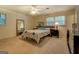 Comfortable bedroom with ceiling fan, carpet and natural light at 2340 Rolling Acres Sw Dr, Conyers, GA 30094