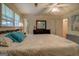 Cozy bedroom featuring neutral decor and ceiling fan at 2340 Rolling Acres Sw Dr, Conyers, GA 30094