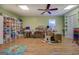 Spacious bonus room with hardwood floors and natural light at 2340 Rolling Acres Sw Dr, Conyers, GA 30094