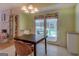 Charming dining area with access to the screened porch and a cozy fireplace at 2340 Rolling Acres Sw Dr, Conyers, GA 30094